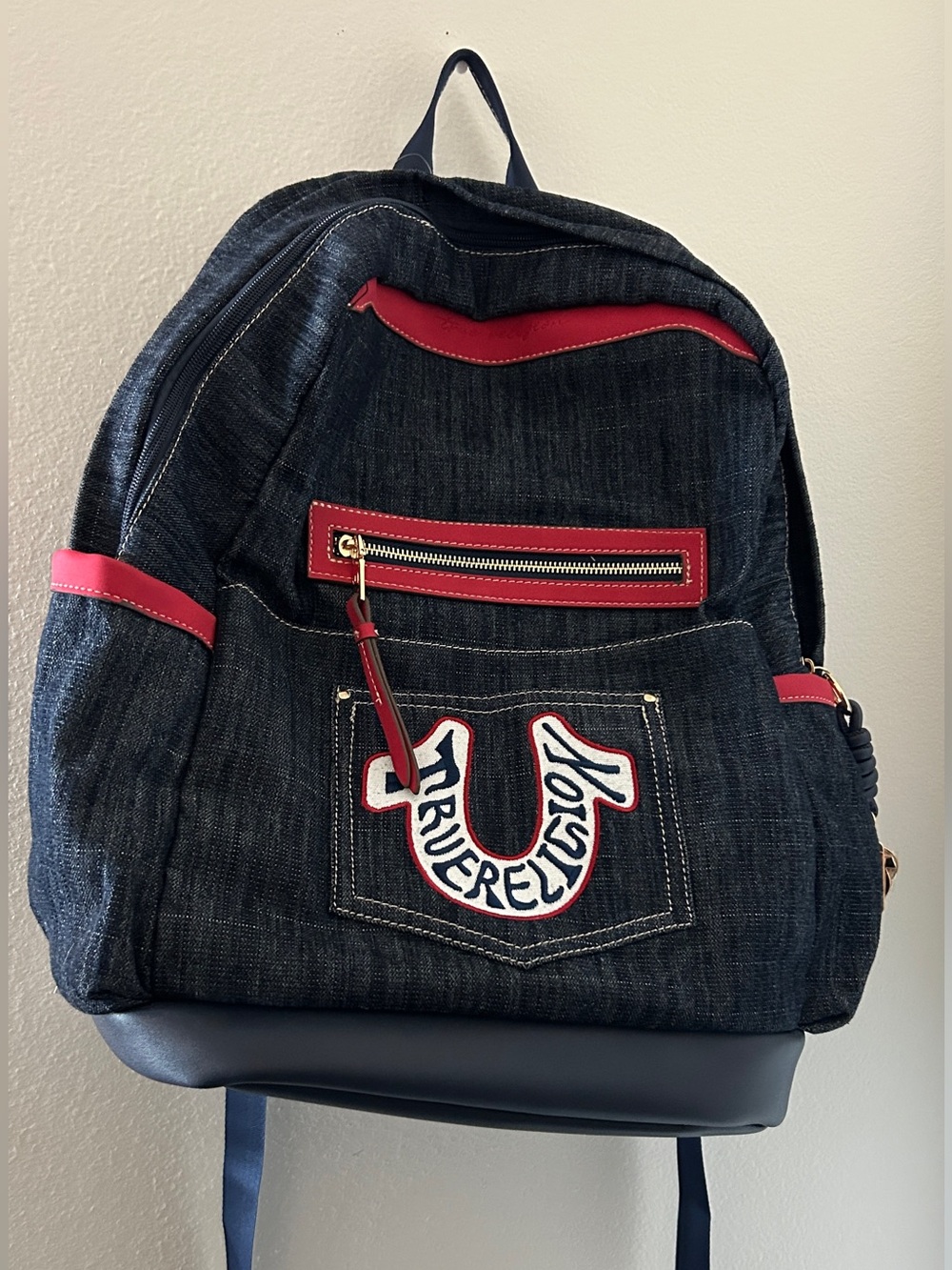 True Religion Dark Denim Backpack with Red Accents